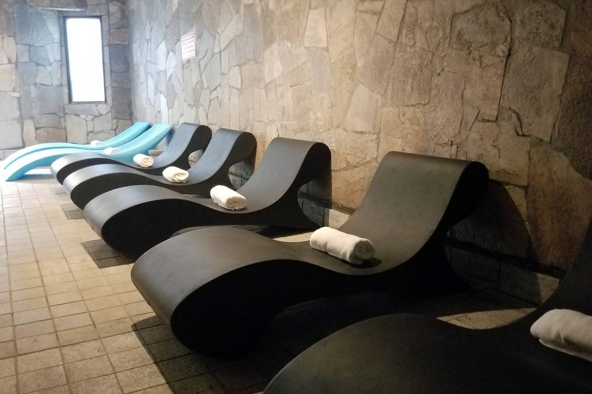 Stone loungers with rolled towels in the quiet rest area
